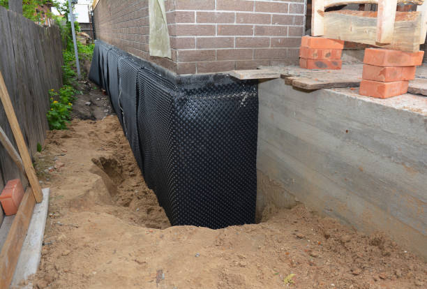 Happy homeowners after waterproofing job in Newport